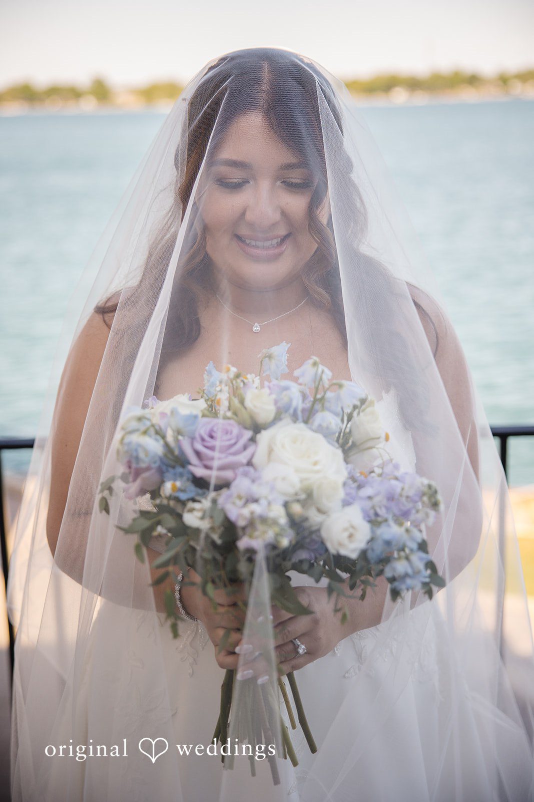 James + Nora Elegant bride with bouquet at St. Clair Inn