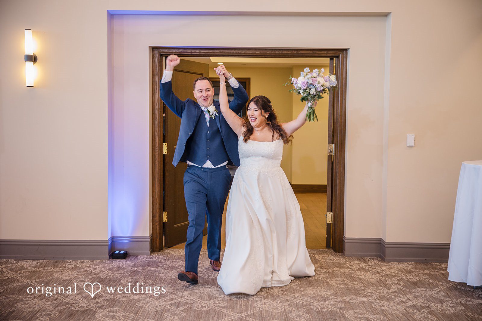 James + Nora Bride and groom entering the reception together at St. Clair Inn