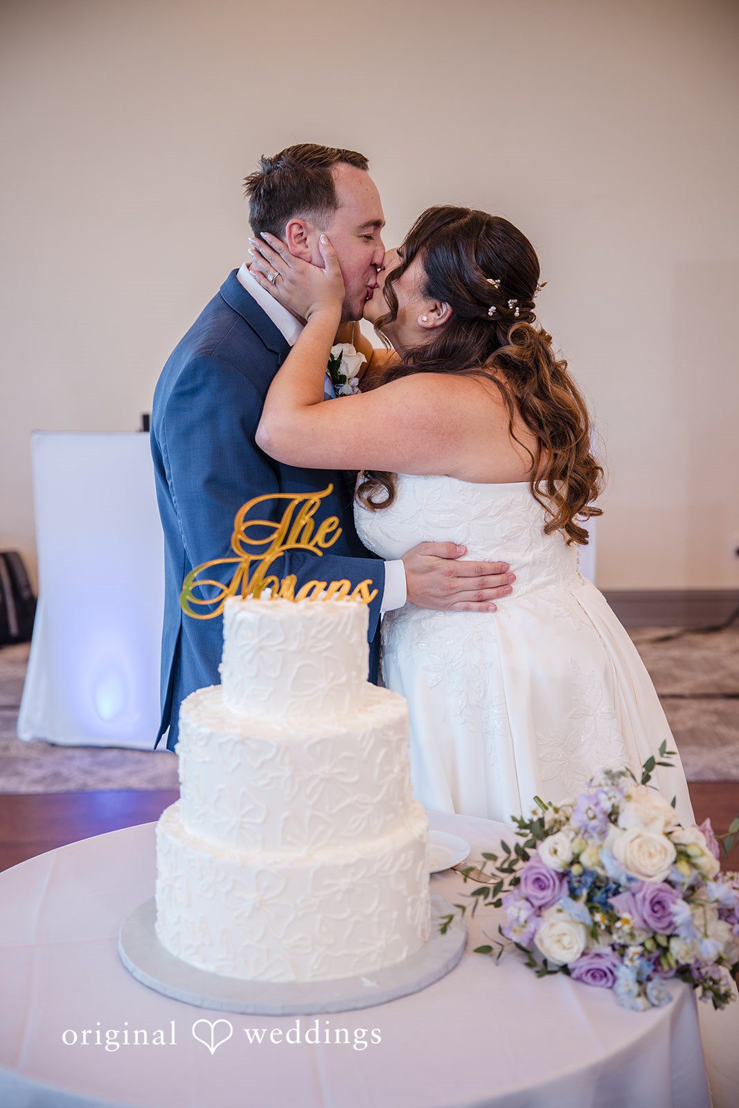 James + Nora Detroit Wedding Photographers capturing couple kissing at St. Clair Inn by Original Weddings