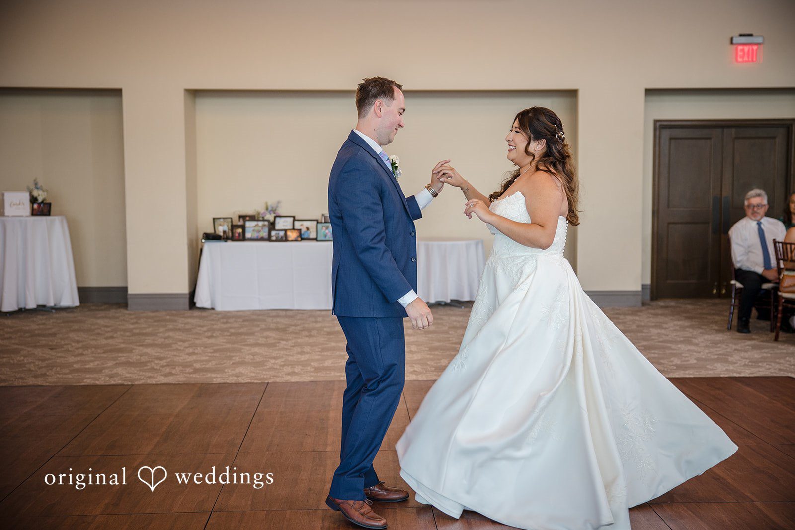 James + Nora Bride and groom dancing together while smiling at St. Clair Inn