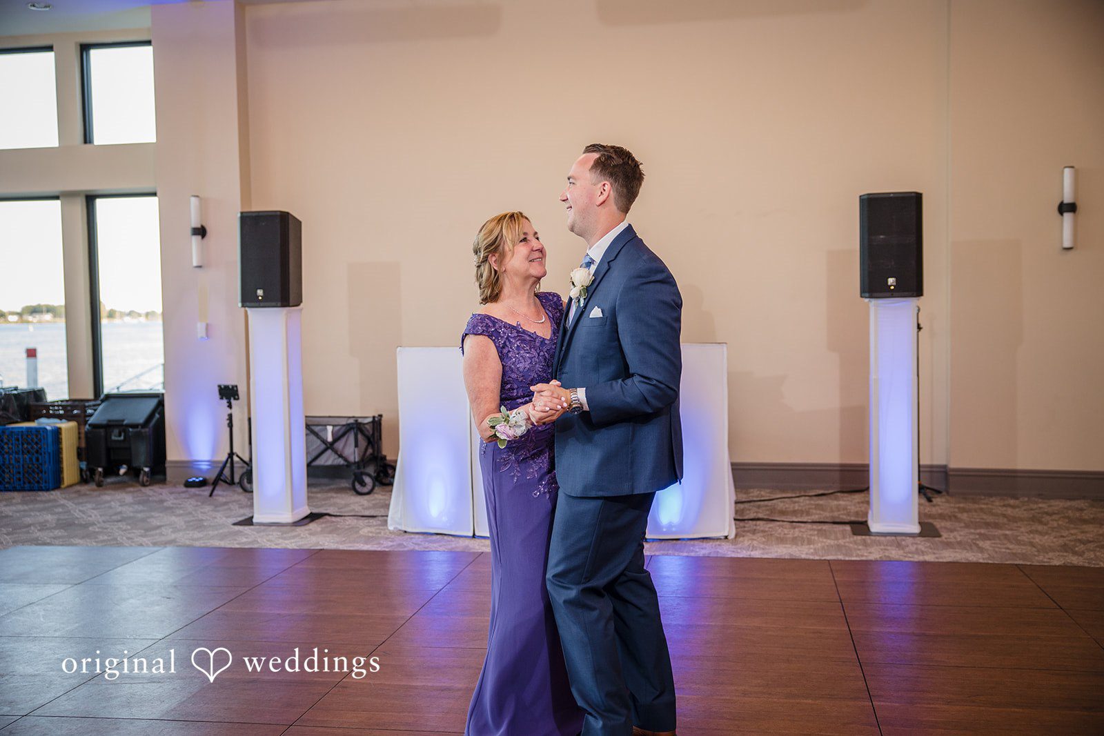 James + Nora Groom dancing with a guest during the reception at St. Clair Inn