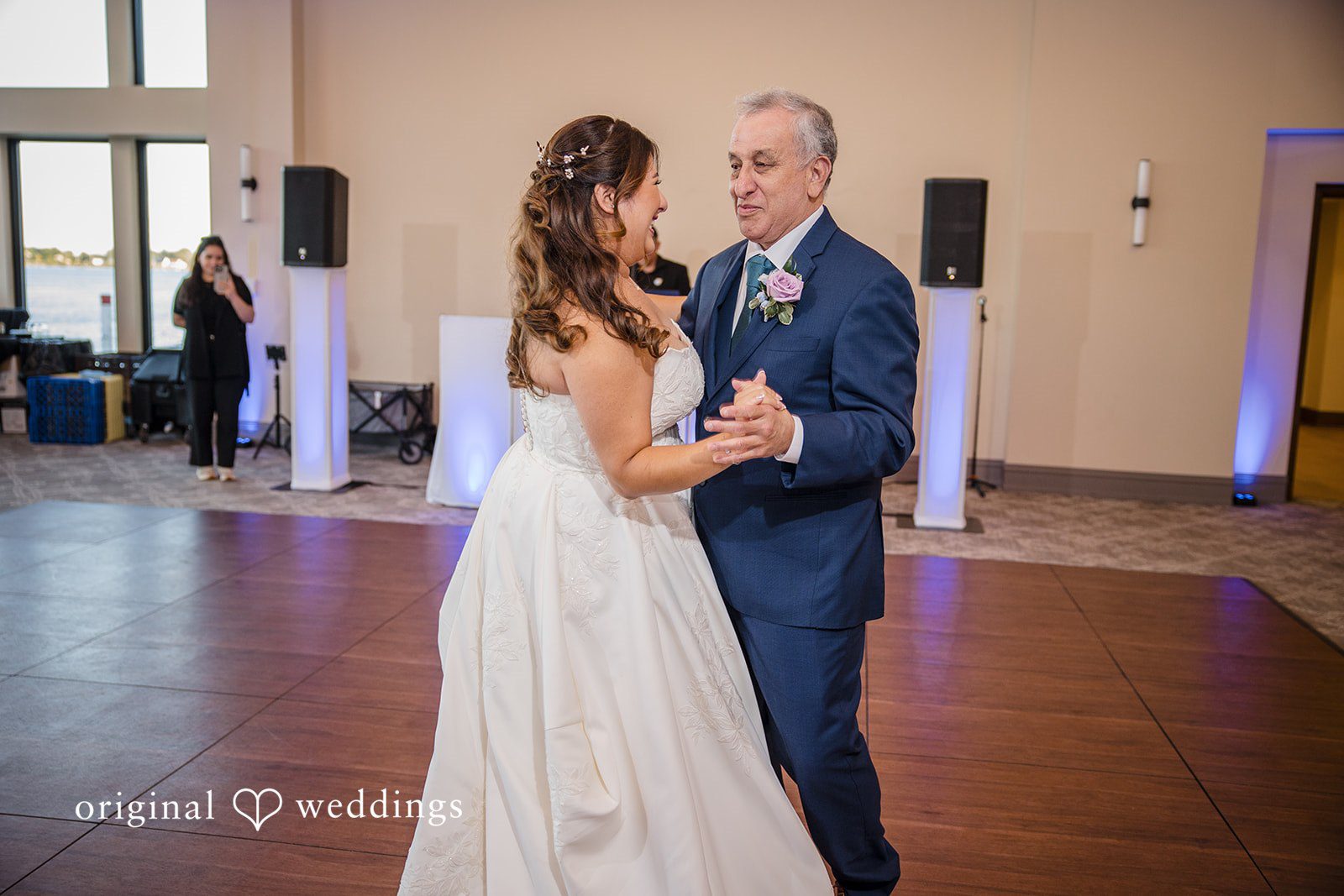 James + Nora Bride dancing with a guest during the reception at St. Clair Inn