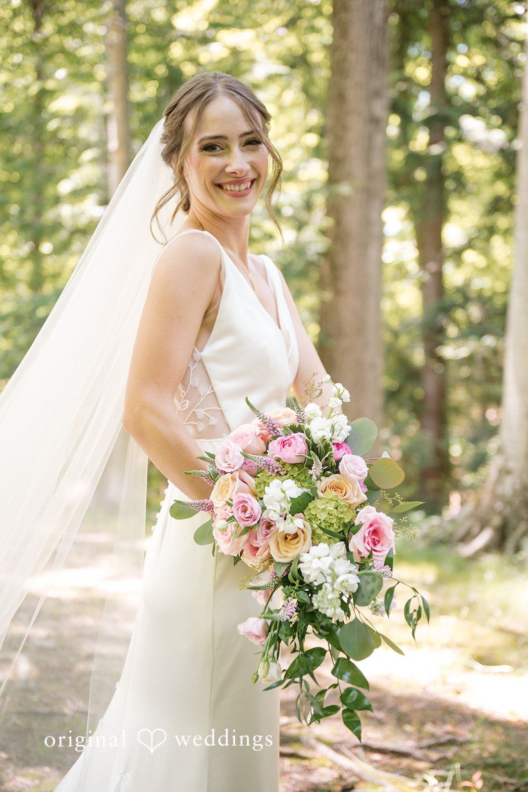 Laura + Robert The bride carrying her huge bouquet