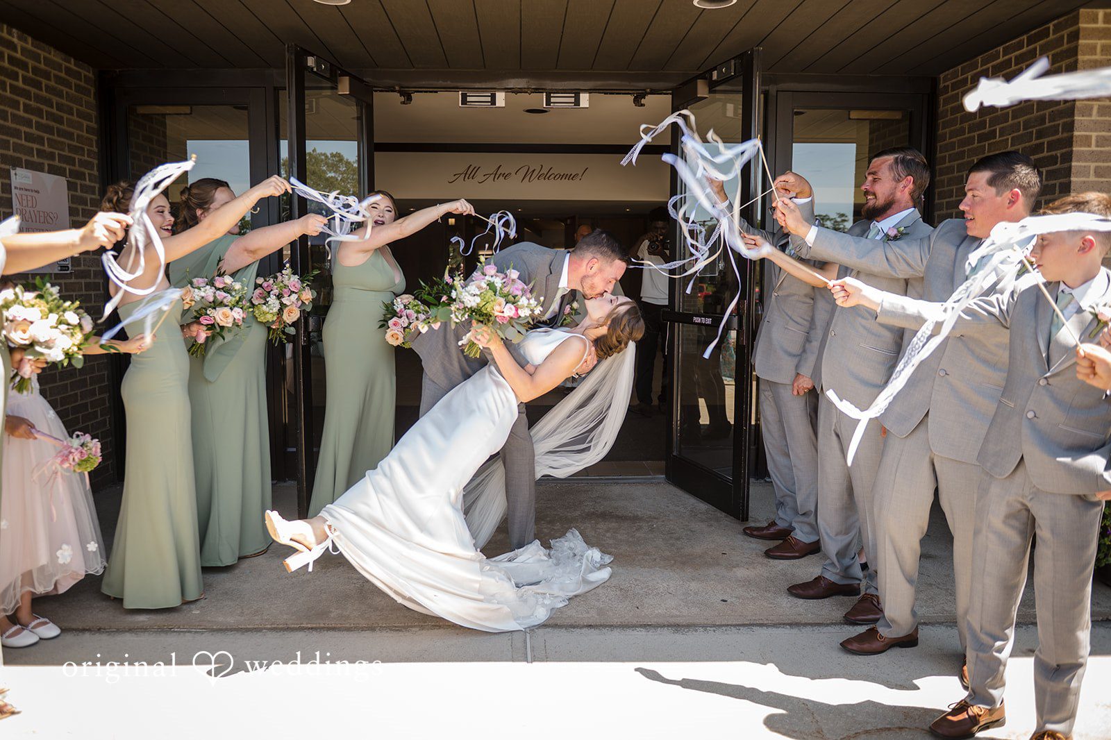 Laura + Robert A romantic portrait of the couple with cheers from their bridal party
