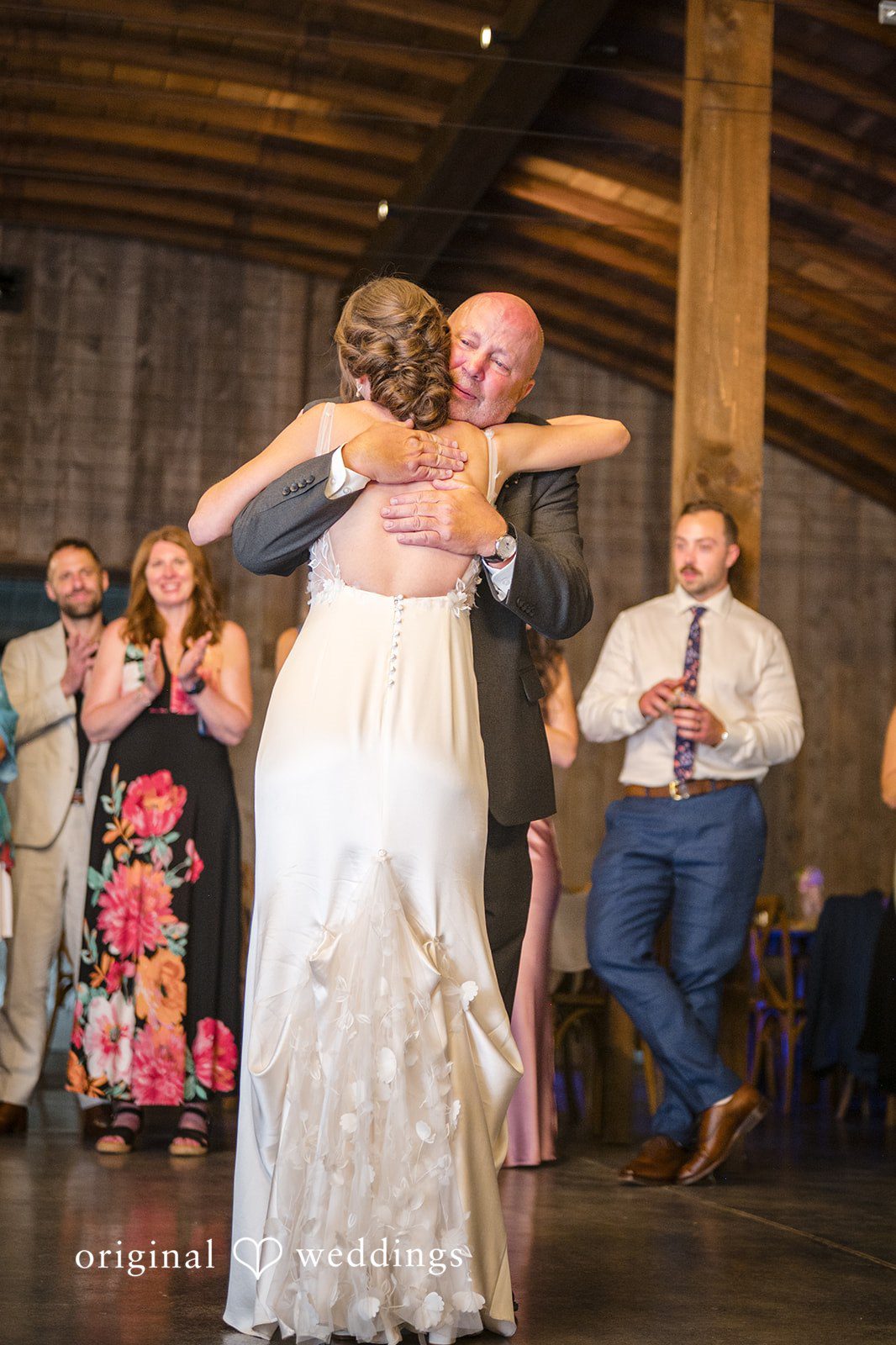 Laura + Robert The bride and her father share a passionate hug