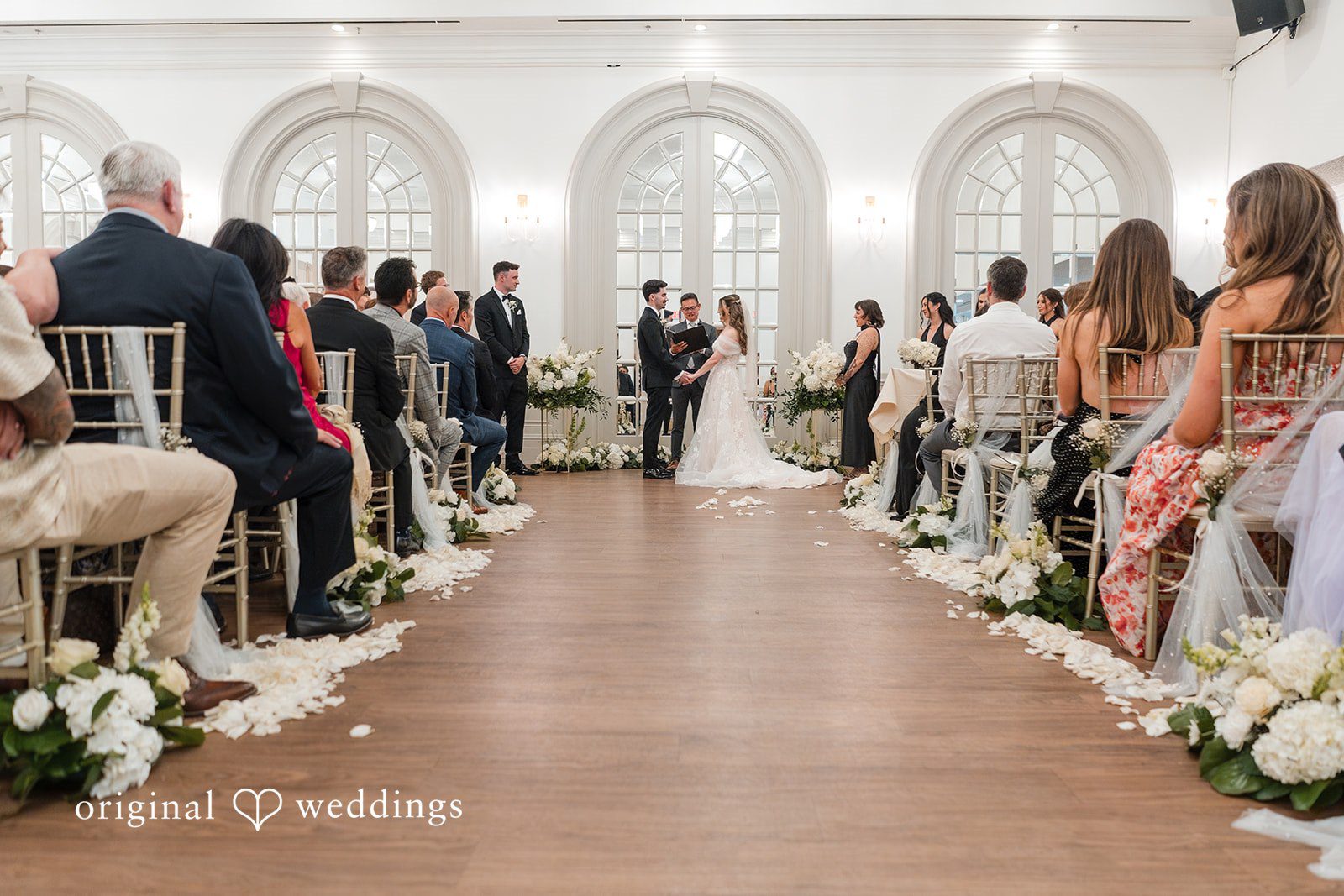 Bride and groom exchanging vows at Sterling Hotel by Sacramento Wedding Photographers from Original Weddings