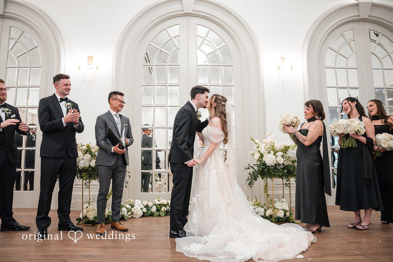 Bride and groom sharing their first kiss at Sterling Hotel after the ceremony