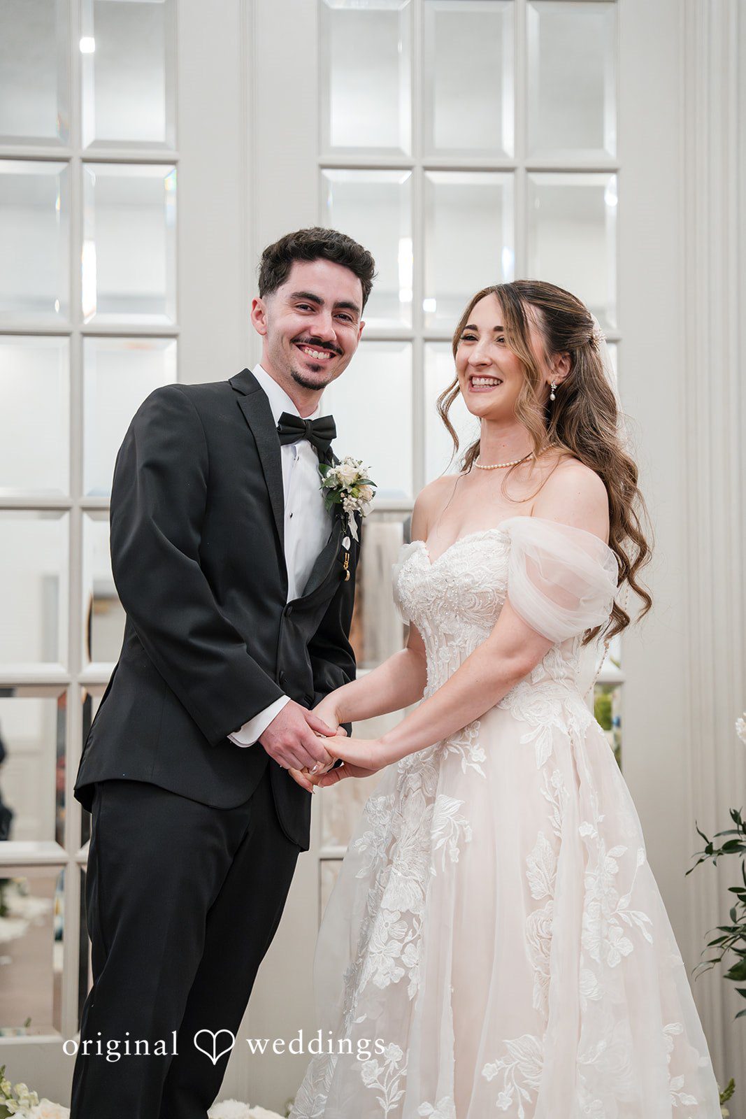 Newly married couple smiling together after their Sterling Hotel wedding ceremony