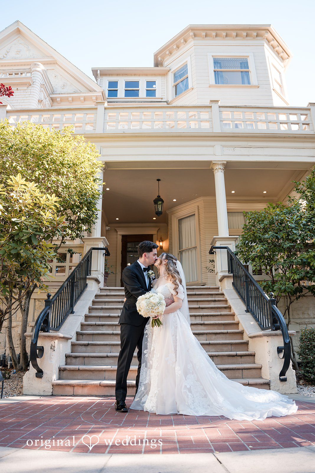 Romantic wedding portrait on the front steps of Sterling Hotel in Sacramento