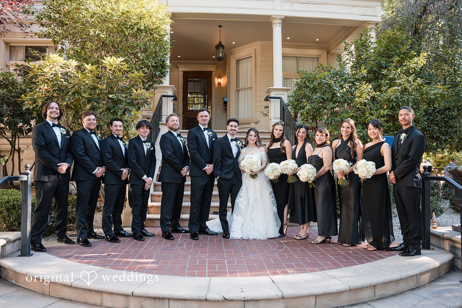 Elegant group wedding picture outside Sterling Hotel captured by Sacramento Wedding Photographers from Original Weddings