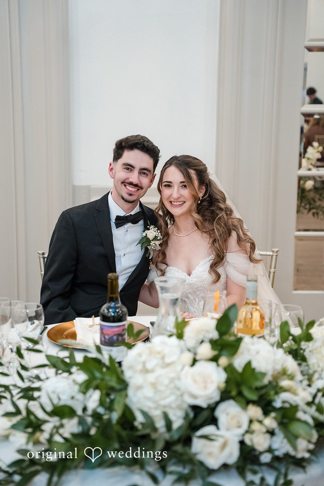 Bride and groom smiling together during their Sterling Hotel wedding reception