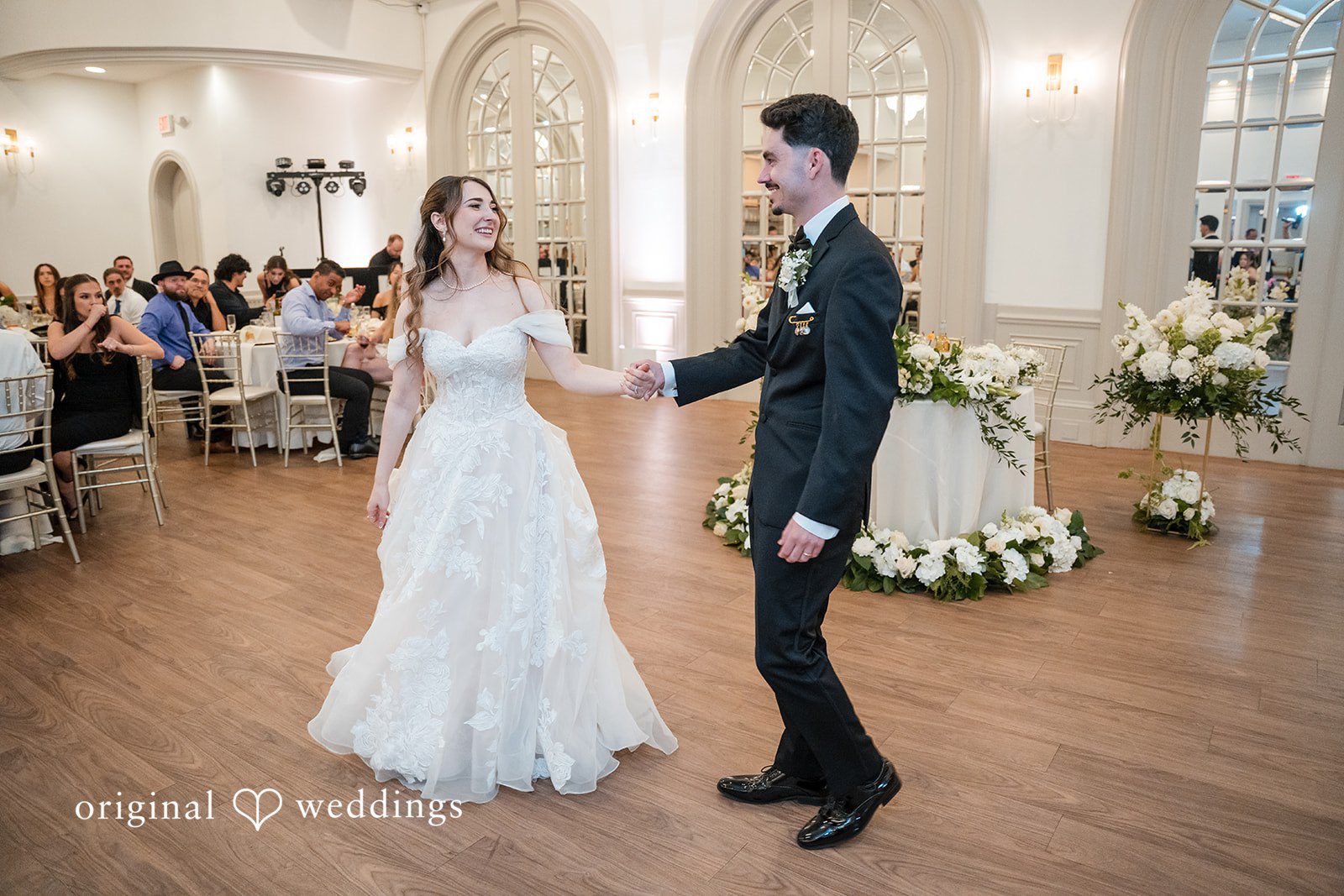 Romantic first dance inside Sterling Hotel surrounded by family and friends.