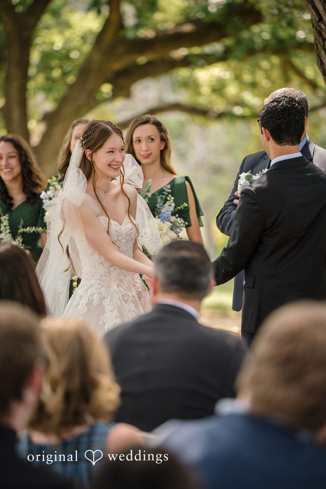 Morgan + Luke Guests watch a wedding ceremony from their seats at Stonebridge Wedding & Event Venue.
