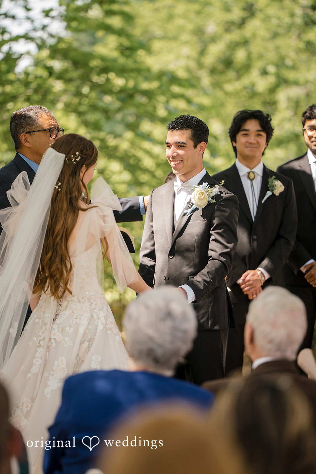 Morgan + Luke A bride and groom stand together during their wedding ceremony.
