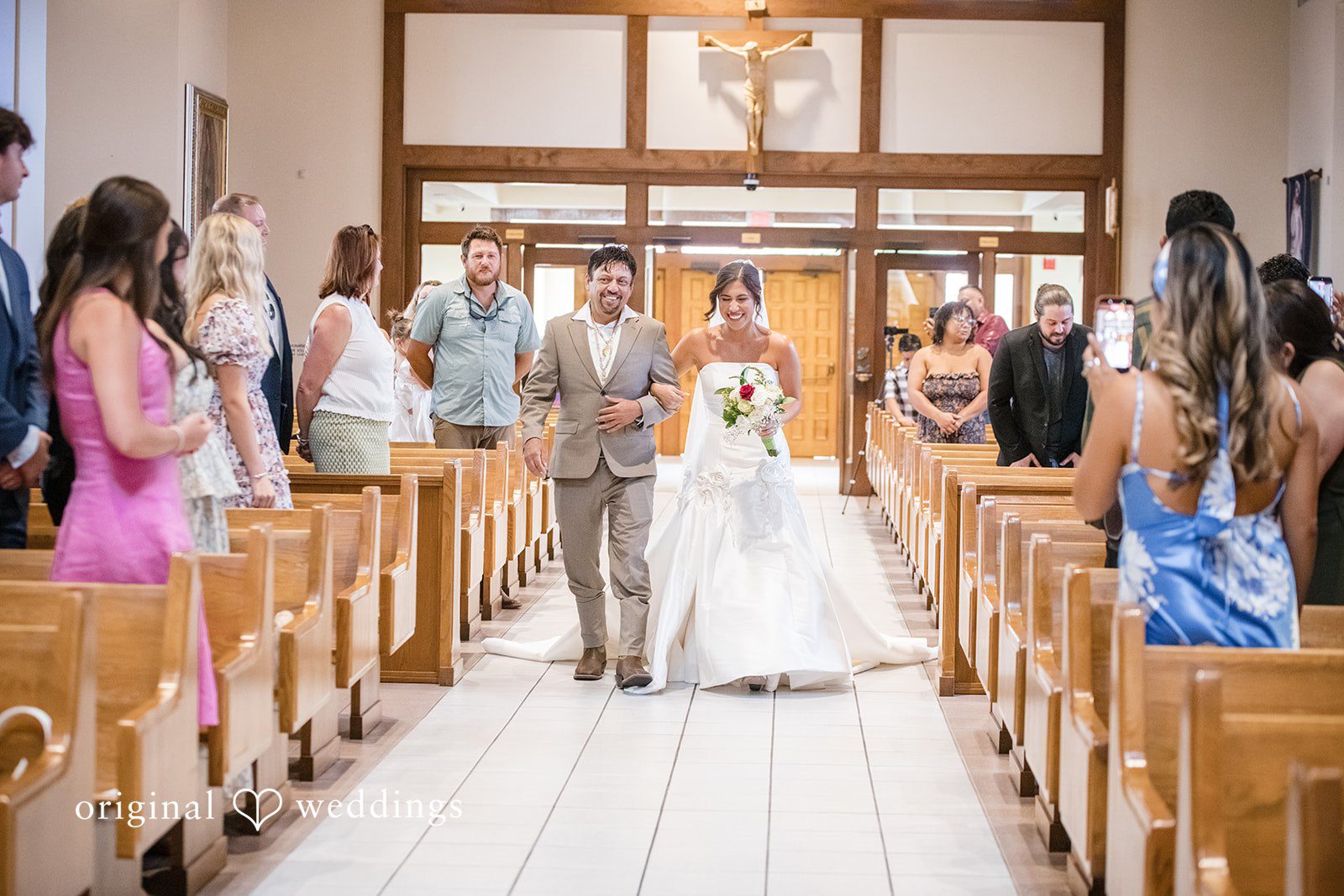 Bride making her entrance during the wedding ceremony at San Pedro Catholic Church