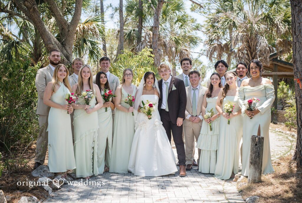 Tampa Wedding Photographers capturing couple with bridesmaids and groomsmen at San Pedro Catholic Church by Original Weddings