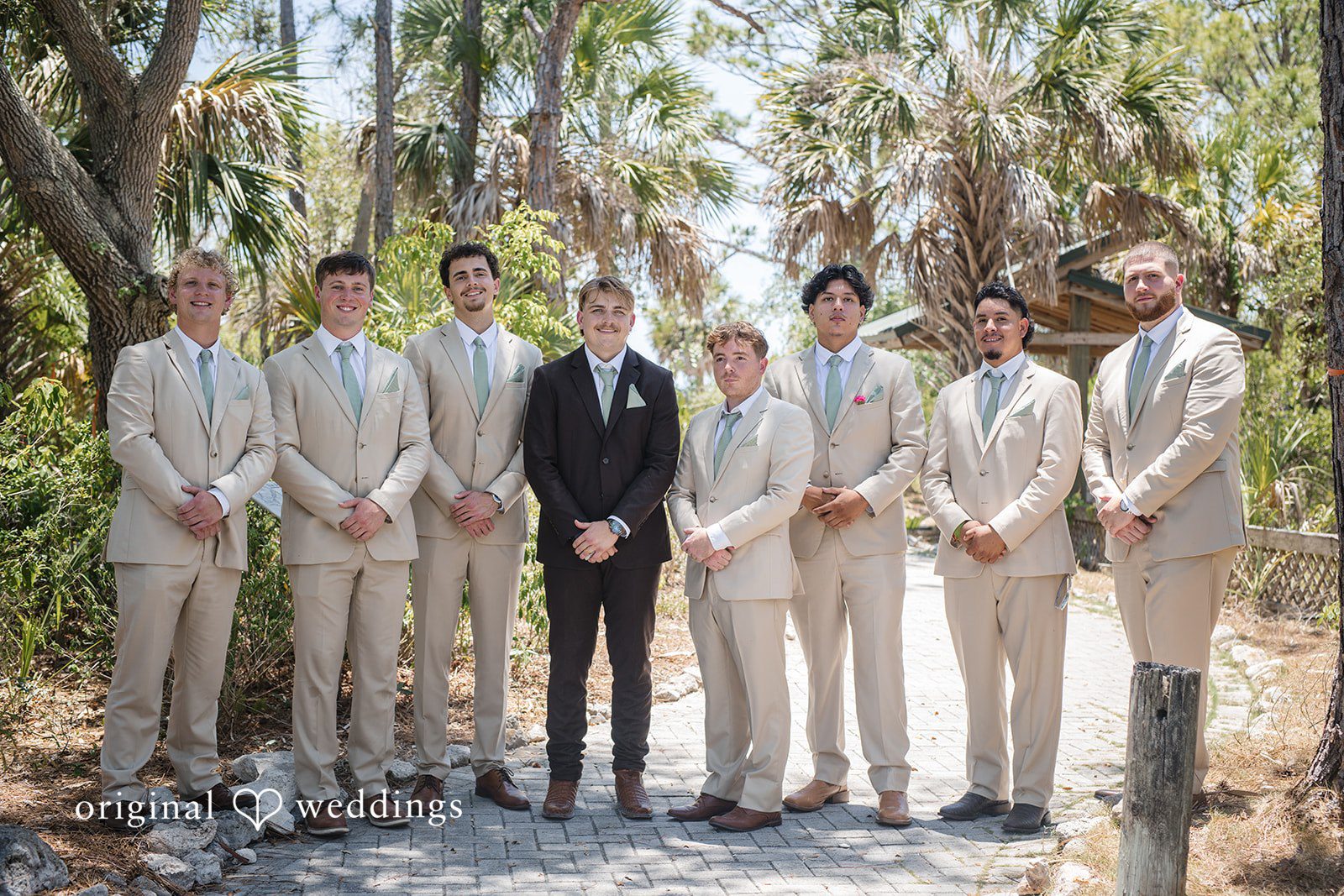 Groom smiling with the groomsmen before the ceremony at San Pedro Catholic Church