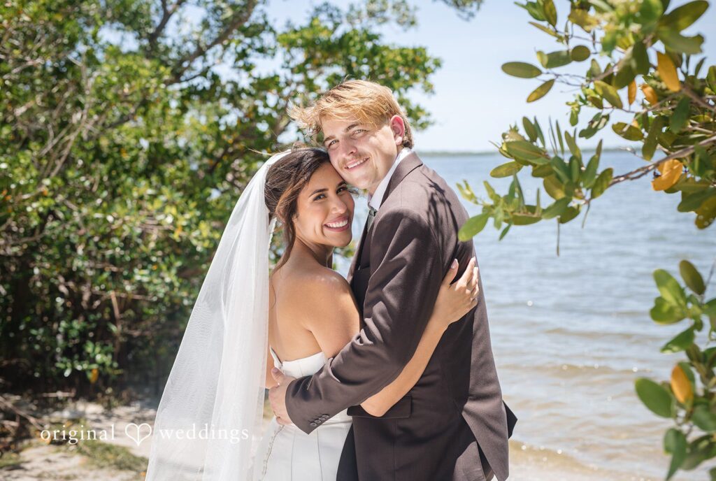 Tampa Wedding Photographers capturing couple looking at the camera and smiling in a romantic way at Romantic forehead-to-forehead close-up of the couple at San Pedro Catholic Church by Original Weddings