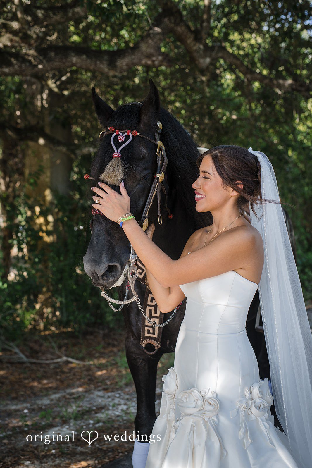 Bride standing beside the horse at San Pedro Catholic Church
