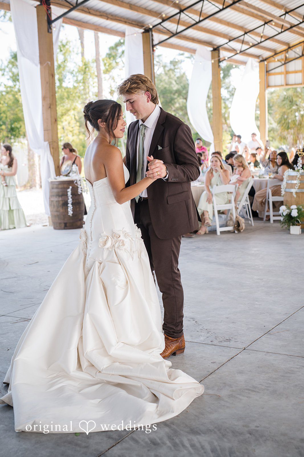 Bride and groom enjoying a dance together at San Pedro Catholic Church