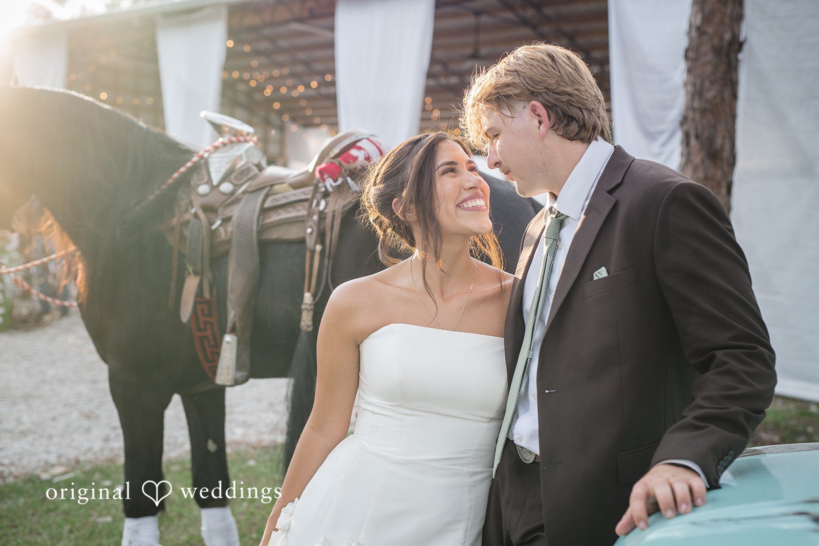 Couple looking at each other with smiles at San Pedro Catholic Church