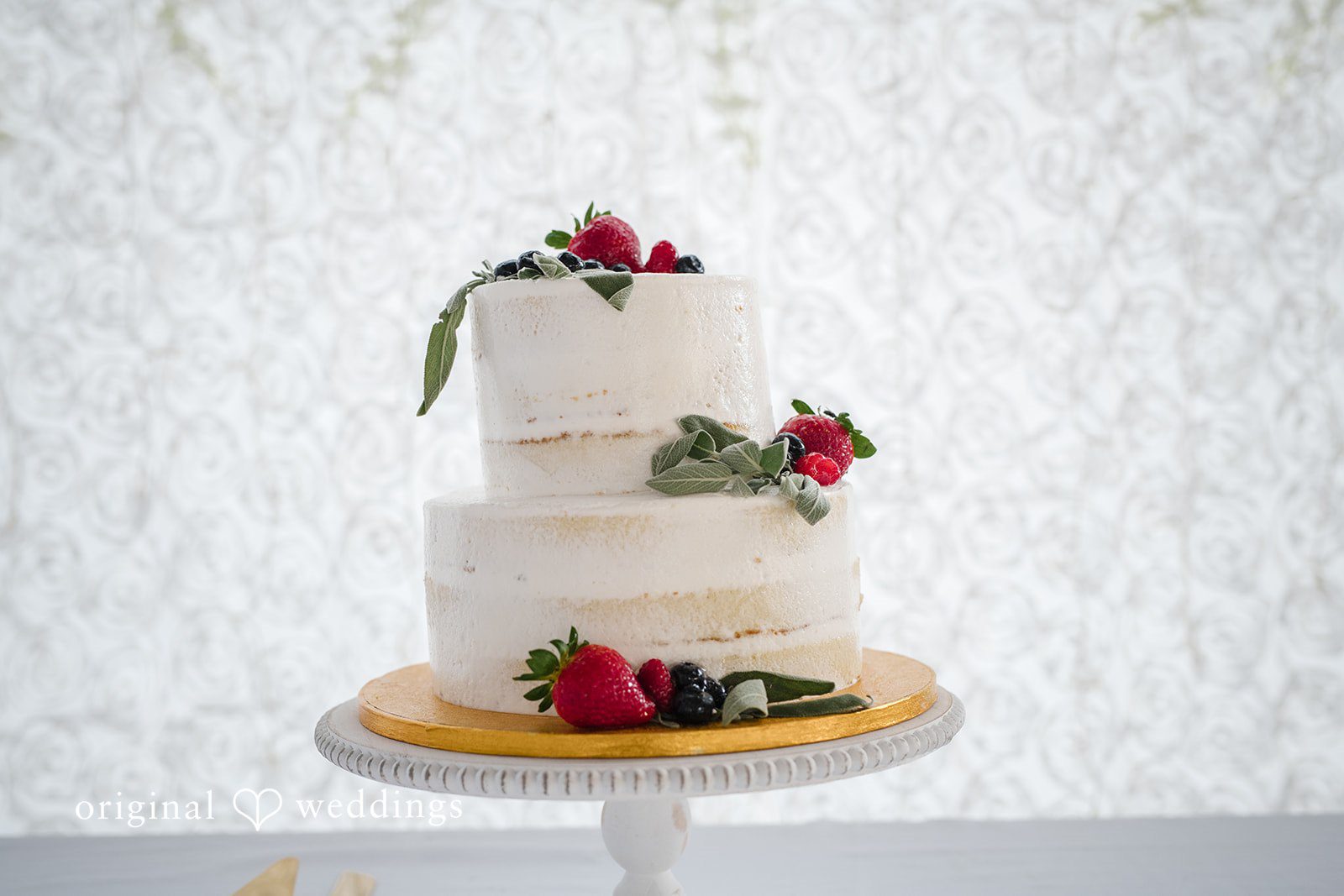 Close-up of the beautifully decorated wedding cake at San Pedro Catholic Church