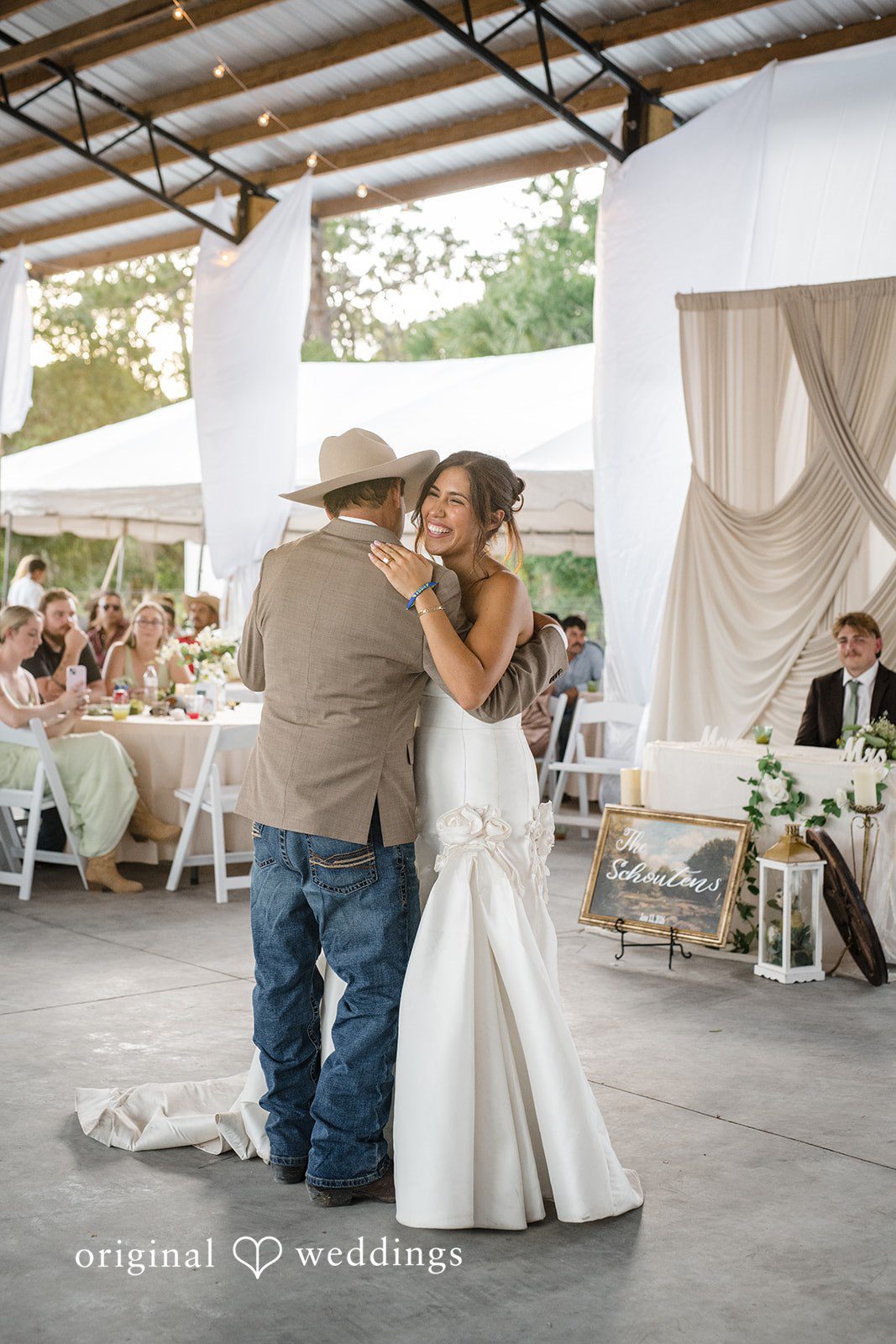 Bride sharing a joyful dance with a loved one at San Pedro Catholic Church