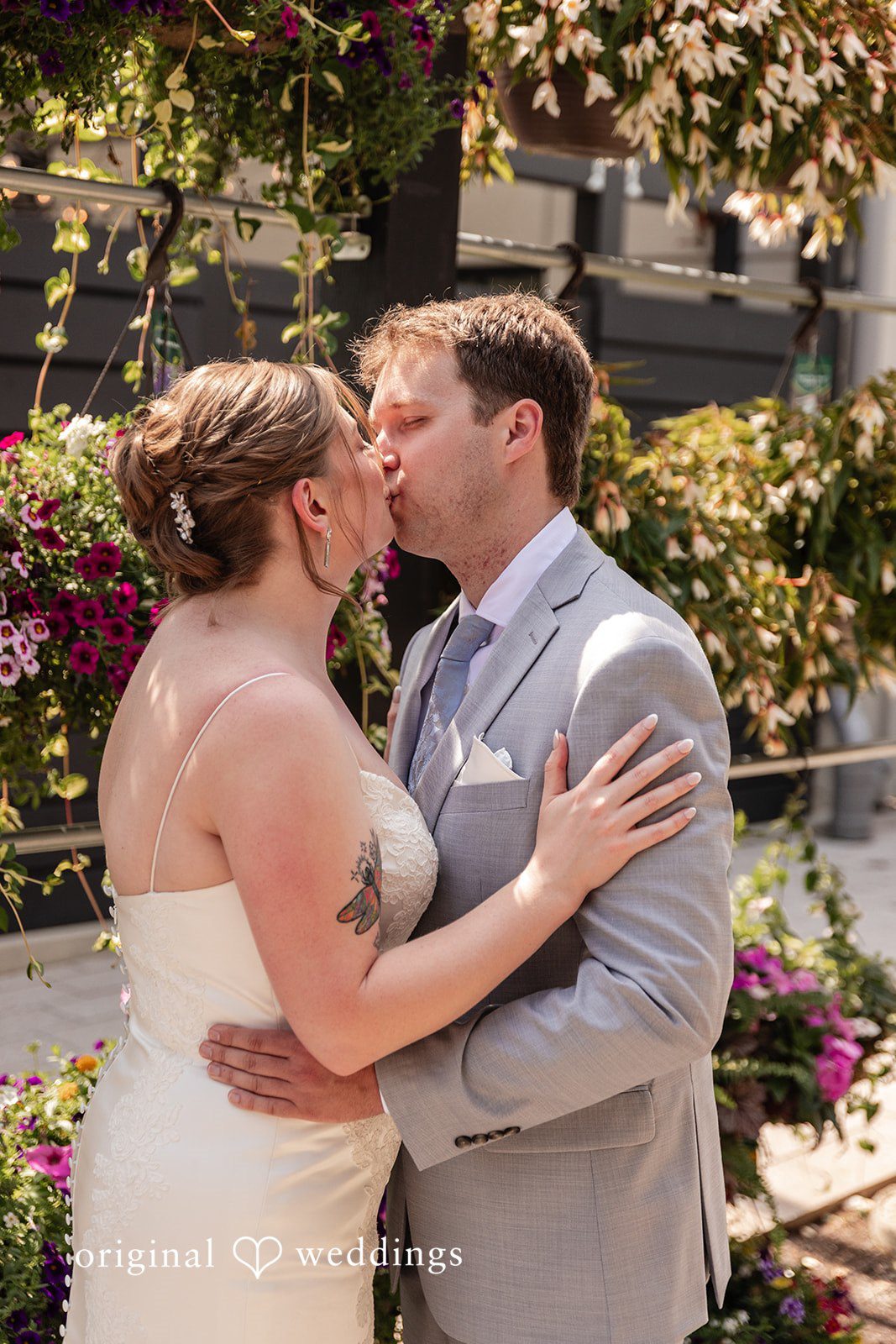 Couple sharing a romantic kiss at Terrain Garden