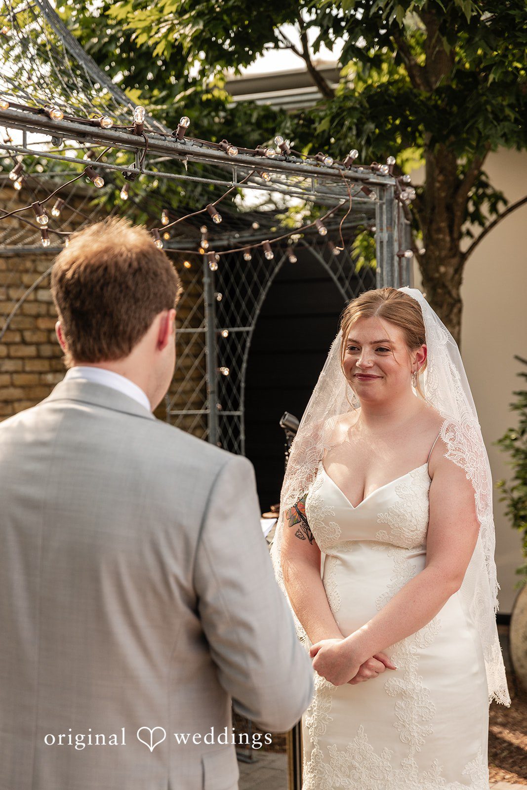 Couple smiling while looking at each other at Terrain Garden