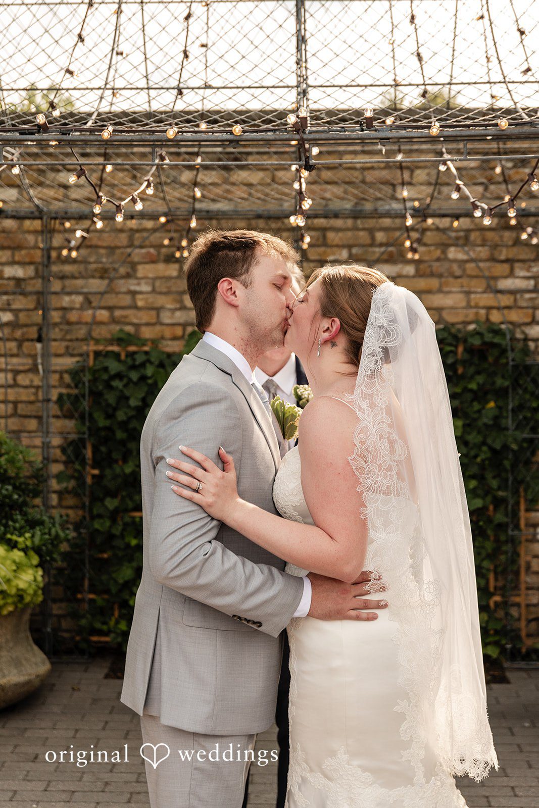 Couple sharing a romantic kiss at Terrain Garden