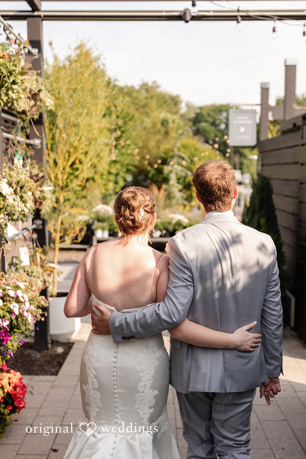Back view of the bride and groom together at Terrain Garden