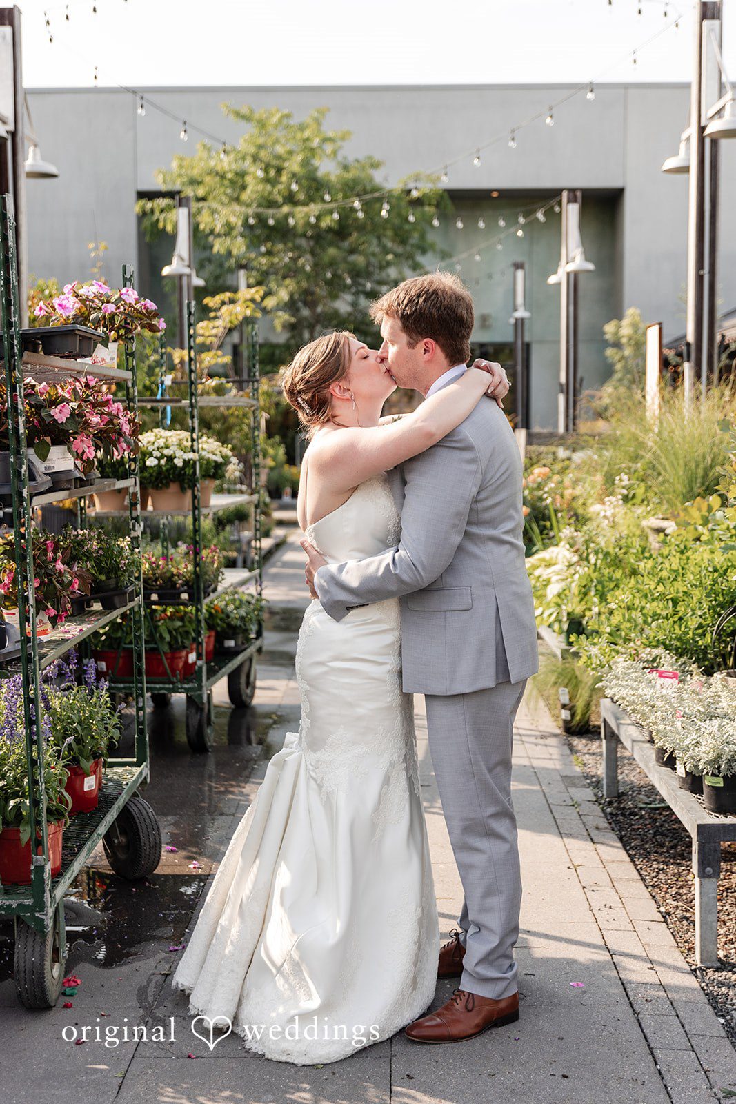 Bride and groom kissing during their portrait session at Terrain Garden