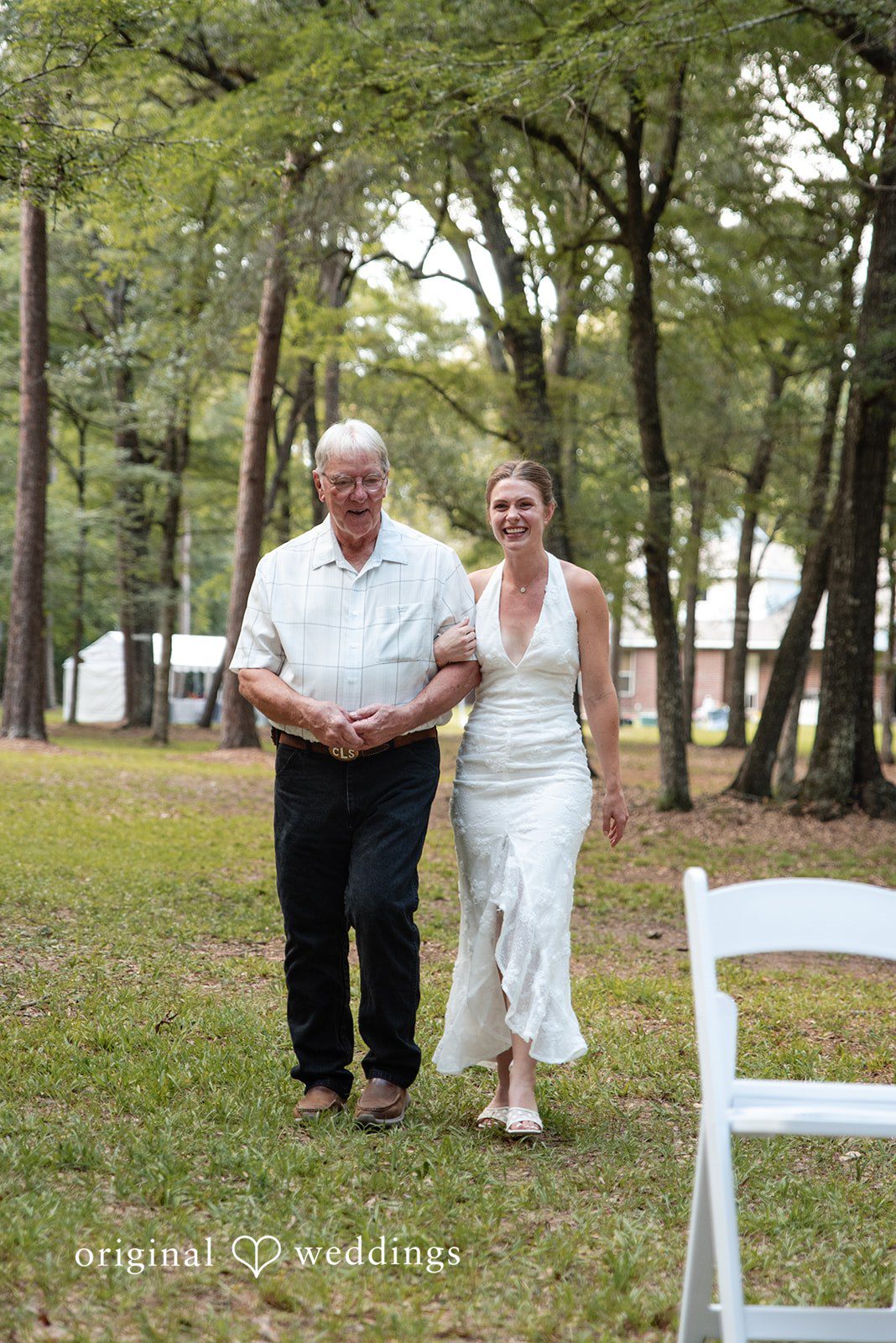 Morgan + Nick The bride's father escorts the bride down the aisle