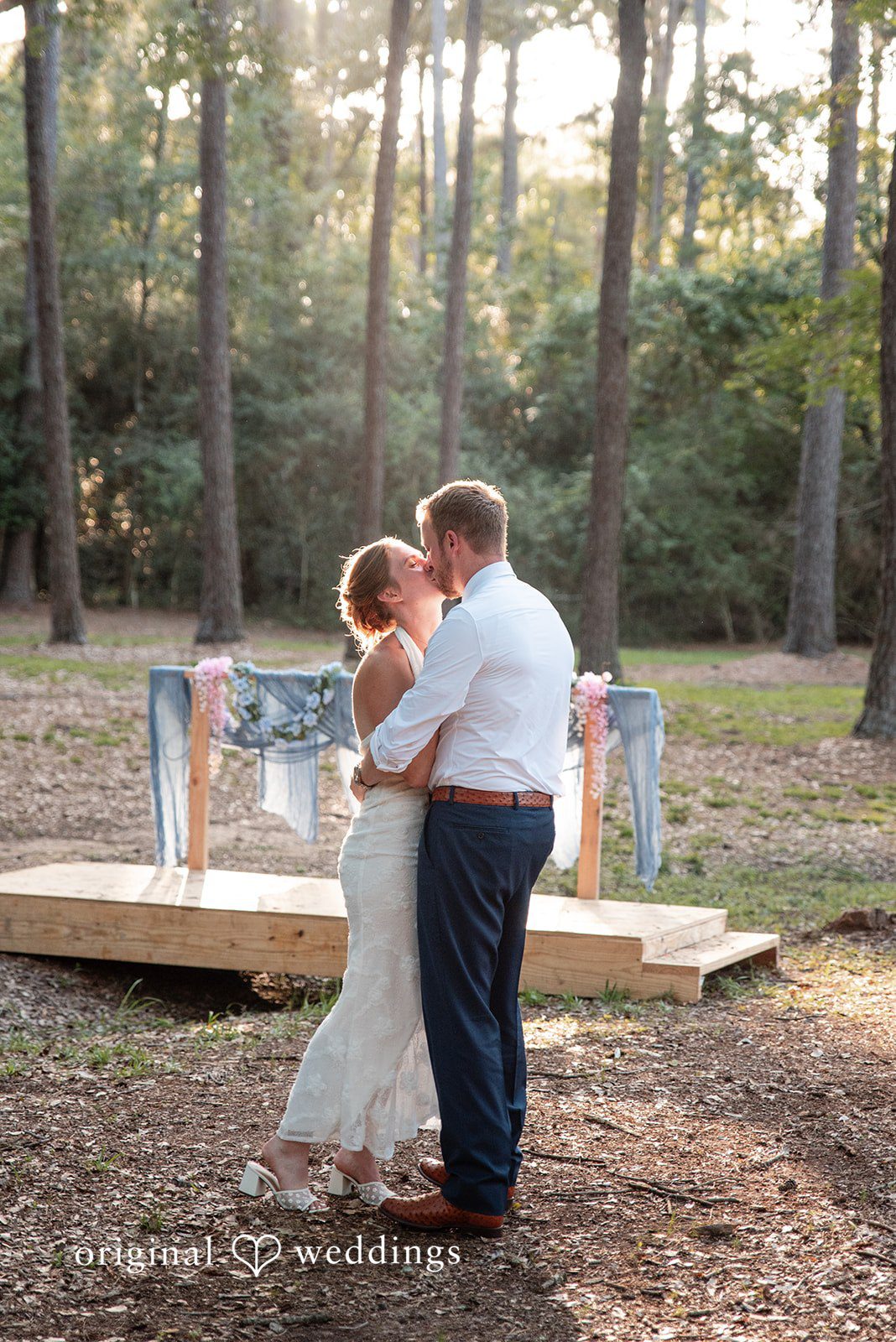Morgan + Nick The couple shares a kiss by the field