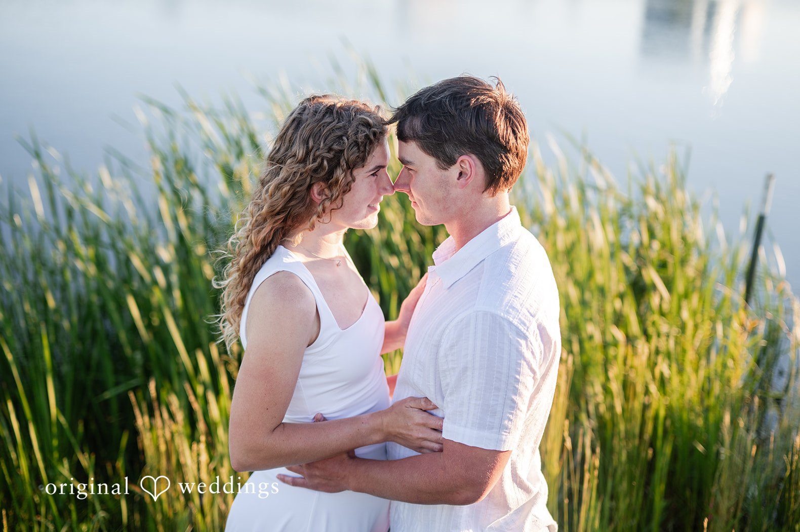 Stunning Portrait of couple at The Adler Planetarium by Chicago Engagement Photographers from Original Weddings.