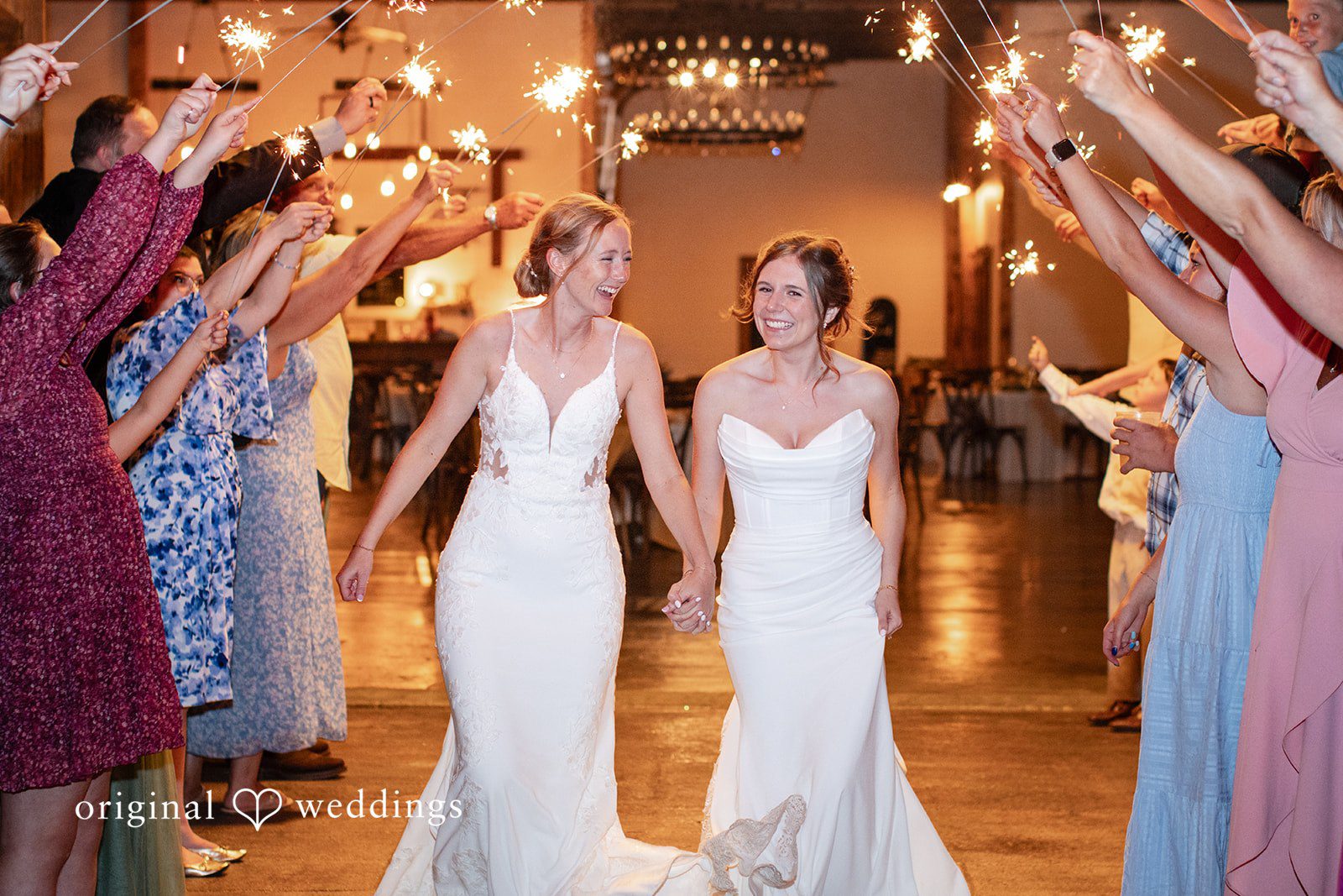 Madison + Ally Brides walking through a sparkler exit at The Barn at Matson Hill captured by St. Louis Wedding Photographers from Original Weddings.