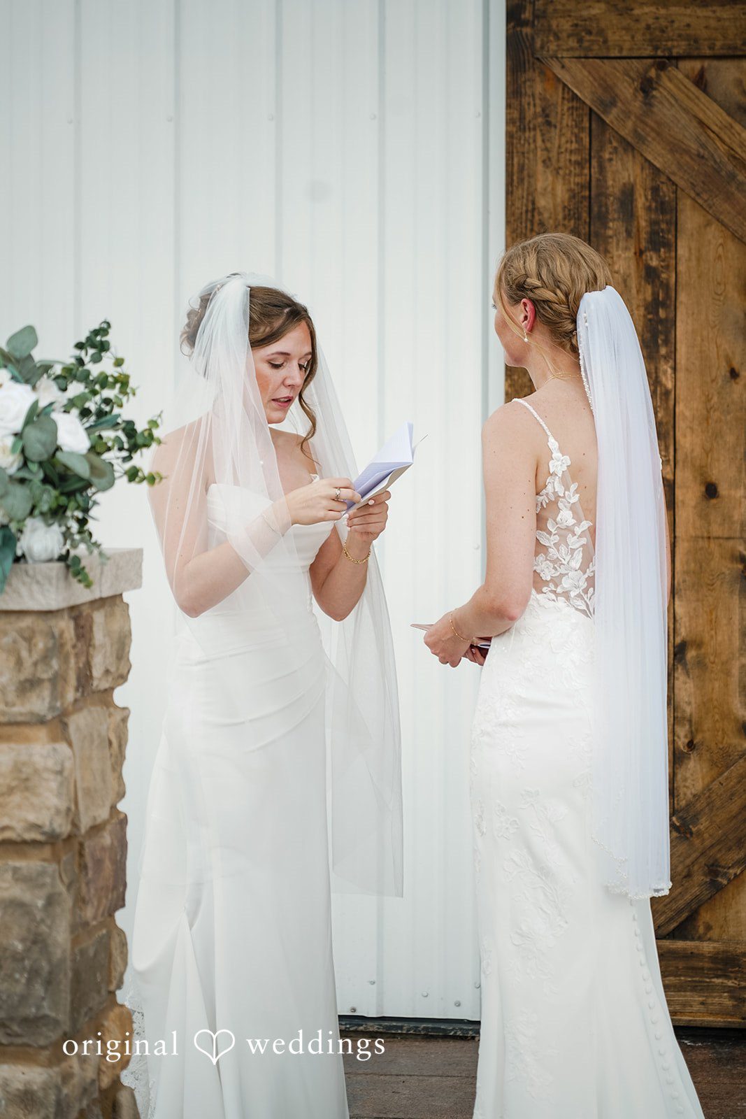 Madison + Ally Bride reading handwritten note while her partner listens nearby.