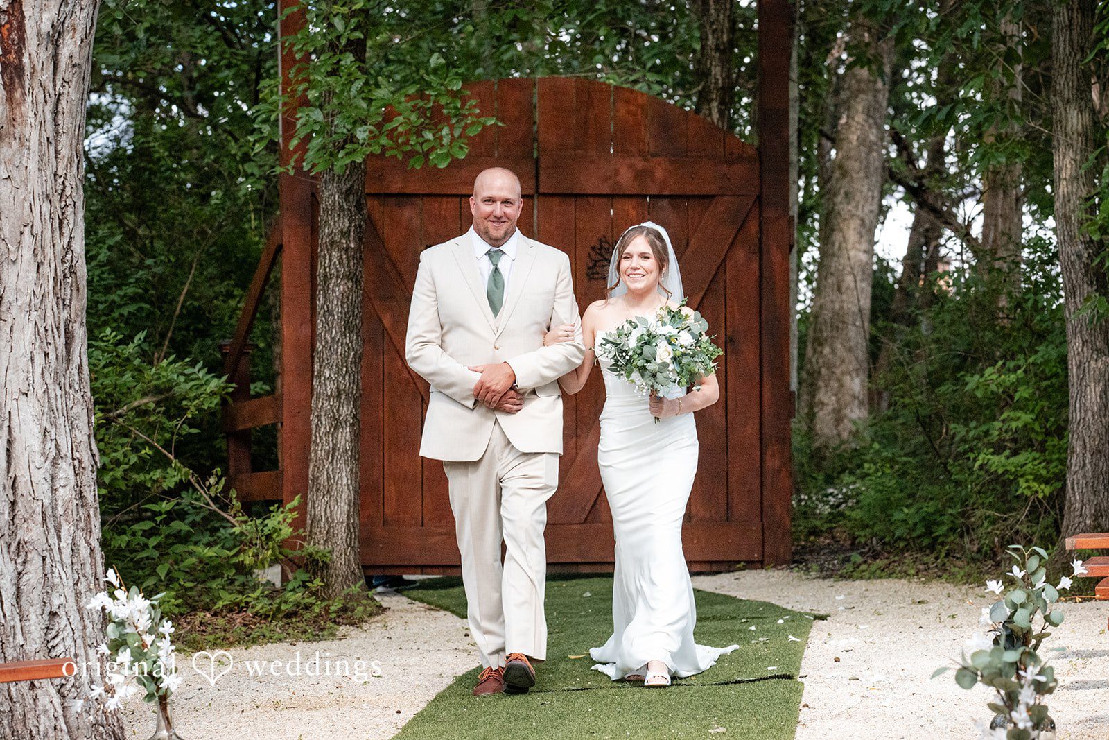 Madison + Ally Bride walking down the aisle at The Barn at Matson Hill