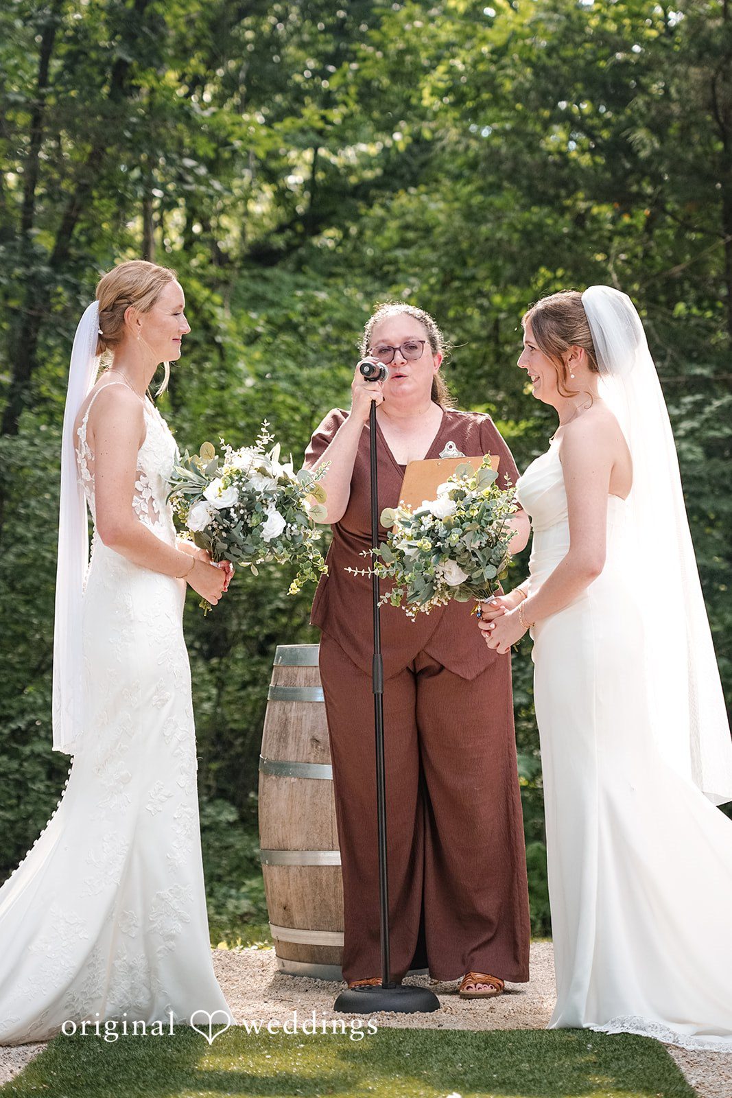 Madison + Ally Two brides exchanging vows during their outdoor ceremony at The Barn at Matson Hill