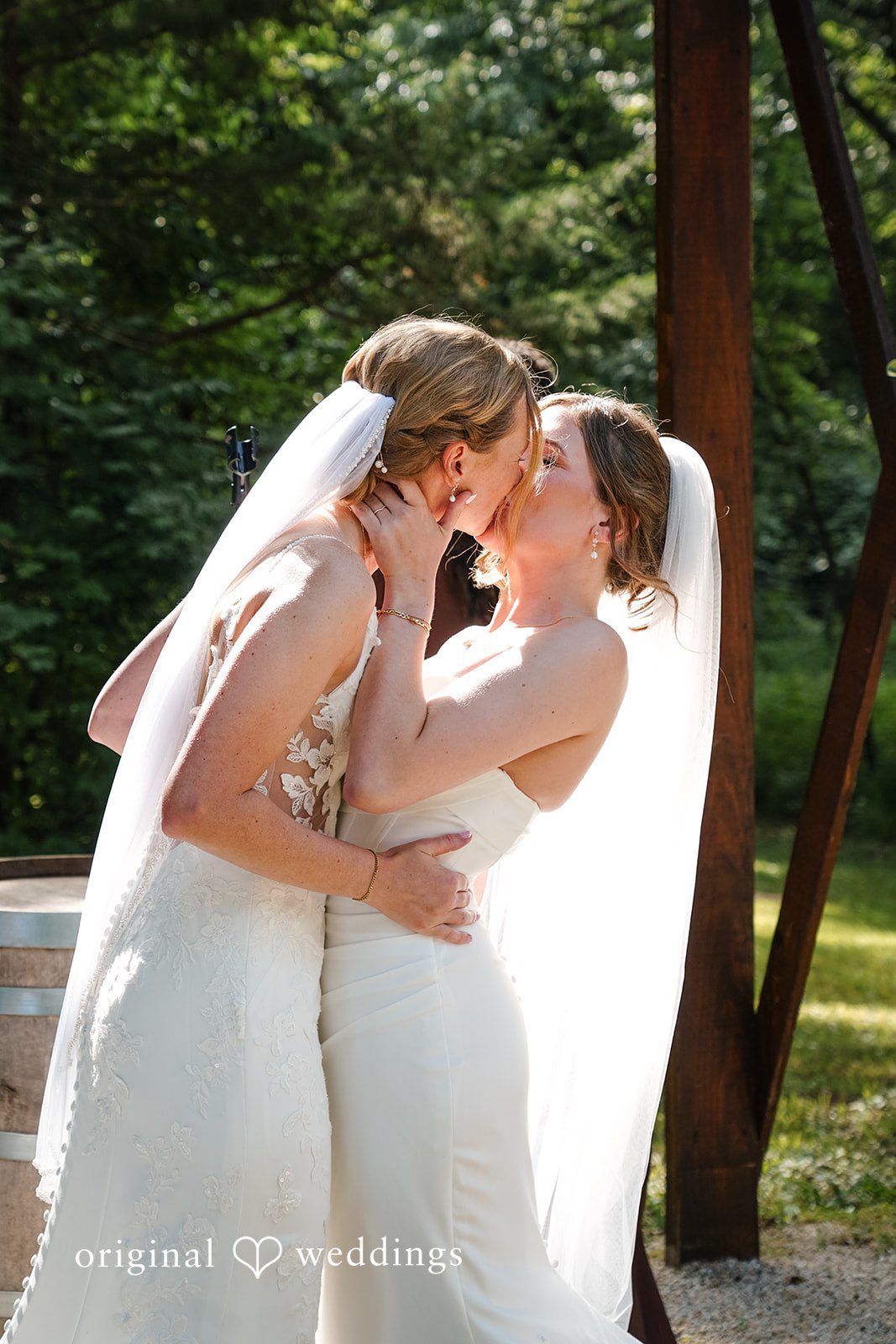 Madison + Ally Outdoor wedding kiss surrounded by natural woodland scenery at The Barn at Matson Hill.