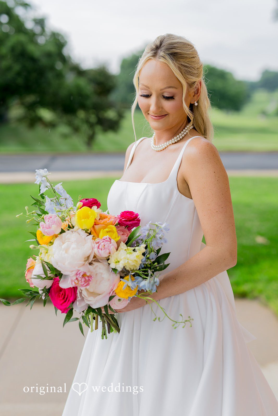 Maret + David The bride carries her beautiful bouquet