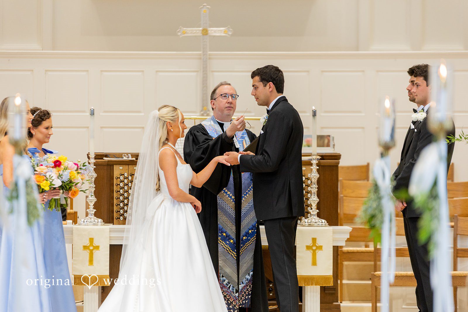 Maret + David The groom puts a ring on the bride's finger