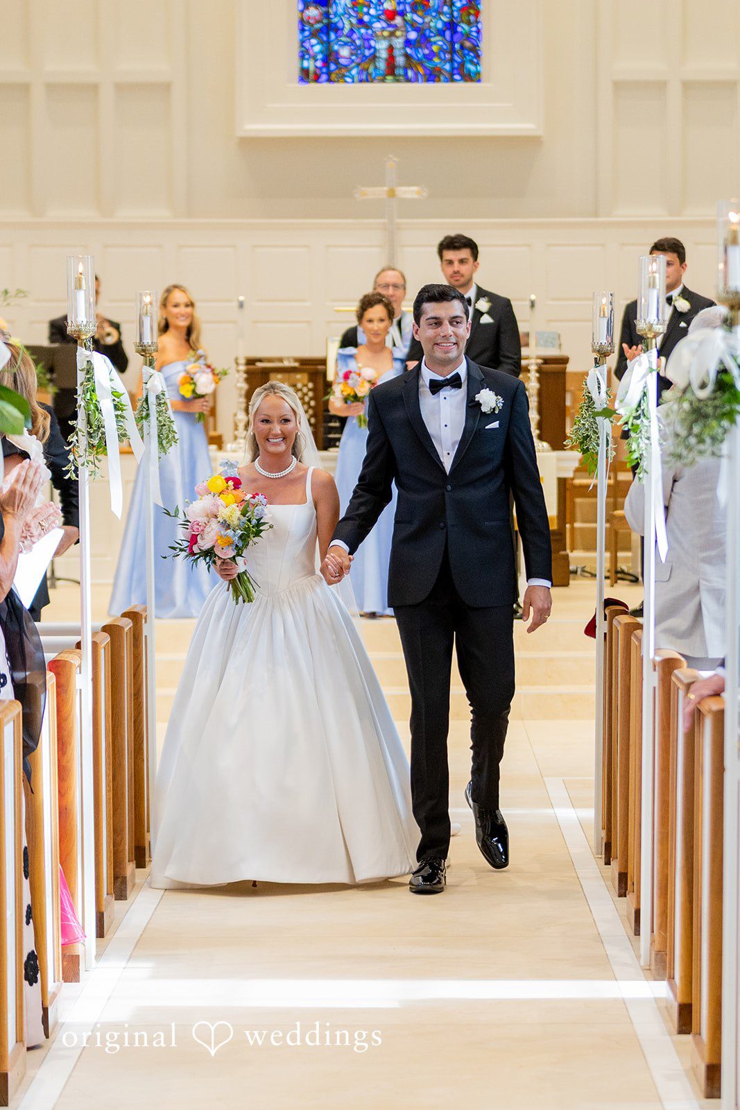 Maret + David The couple makes a joyful exit through the aisle