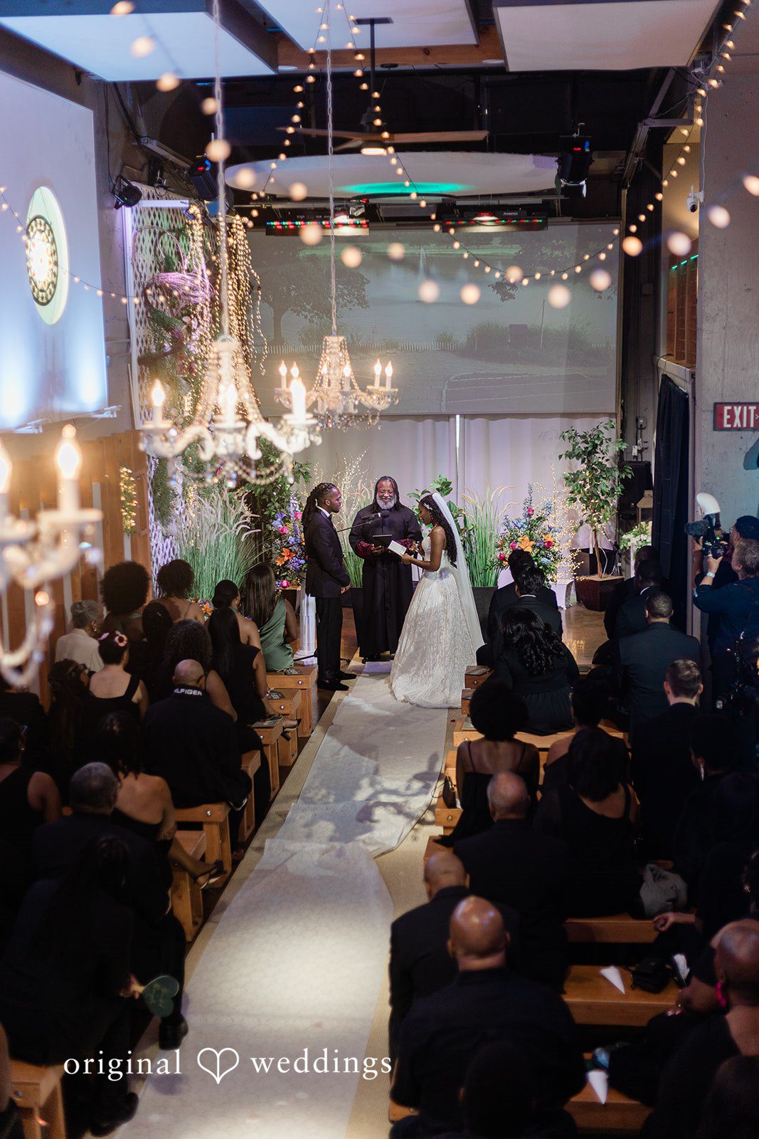 Khanyile + Shontel Wide view of the couple listening to vows during the ceremony