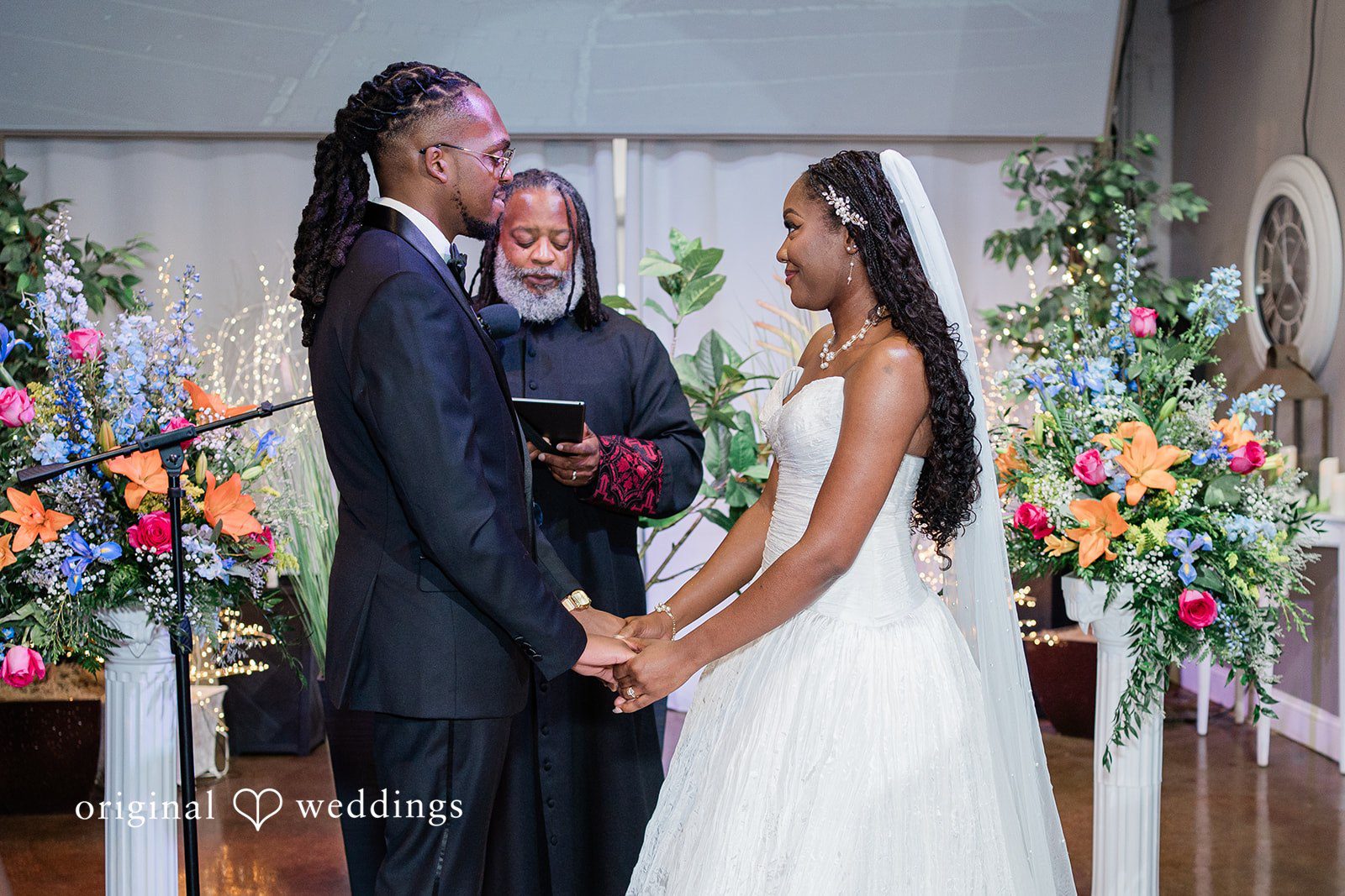 Khanyile + Shontel Bride and groom holding hands during the ceremony