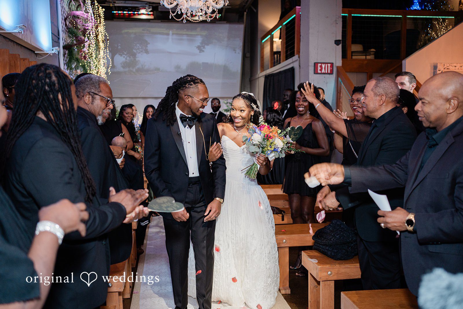 Khanyile + Shontel Newlyweds walking down the aisle after the ceremony