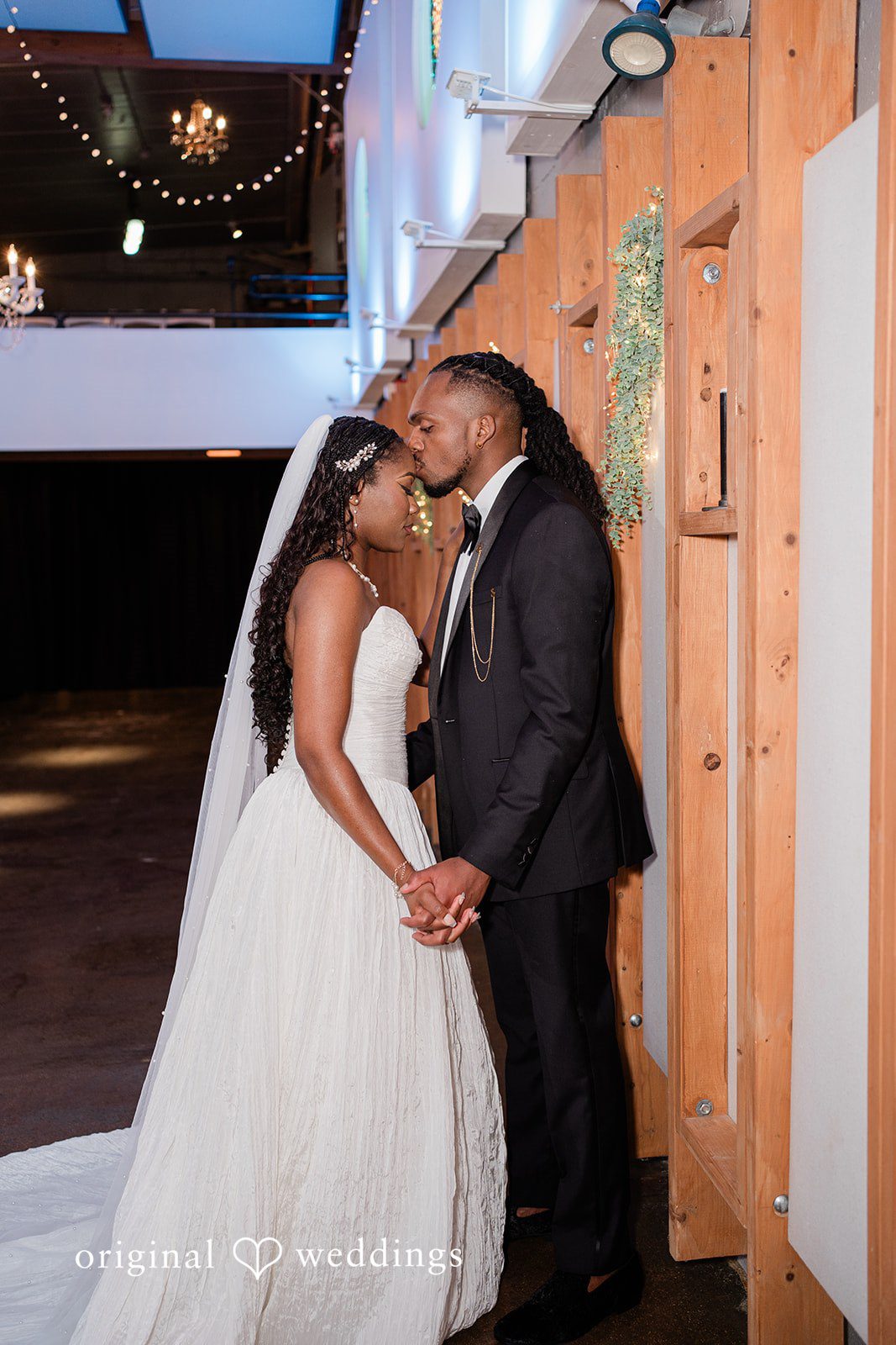 Khanyile + Shontel Groom kissing the bride on the forehead