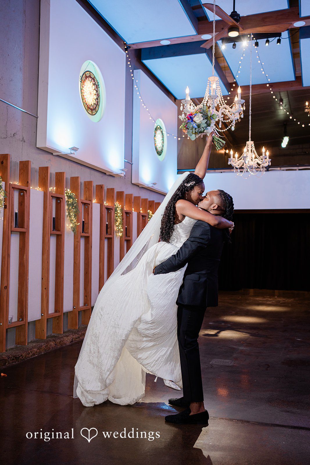Khanyile + Shontel Groom lifting the bride during romantic portraits