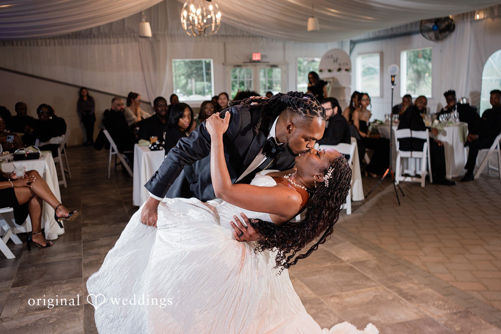 Khanyile + Shontel Bride and groom sharing their first dance at the reception