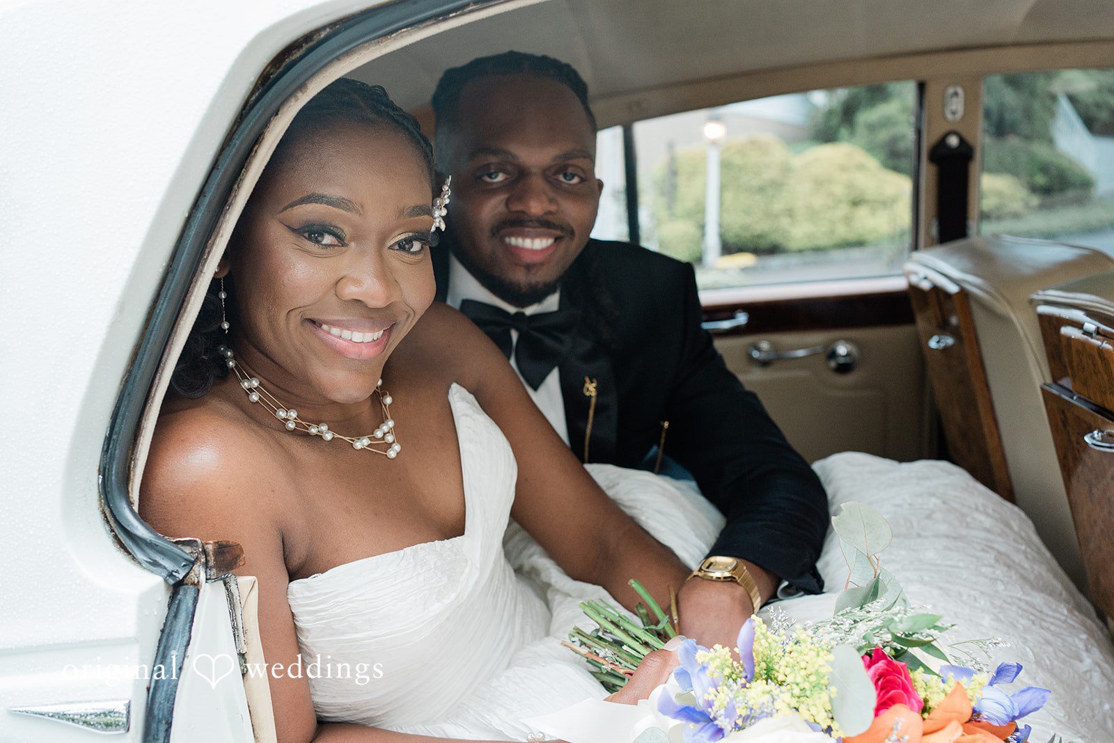 Khanyile + Shontel Bride and groom sharing a moment inside the wedding car